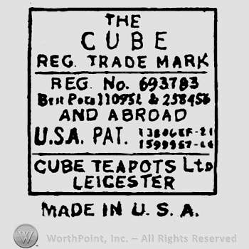 Written inside a rectangle: The Cube Reg Trade Mark, on the bottom is written Cube TeaPots Ltd Leicester, under the rectangle is written Made in USA