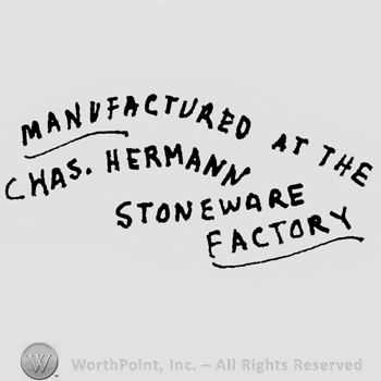 Written on 4 slanted lines: Manufactured at the Chas. Hermann Stoneware Factory