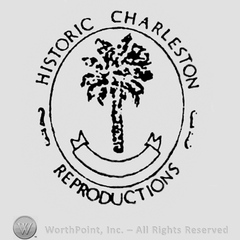 A tree with a ribbon under inside a circle. Around the circle are written: Historic Charleston, Reproductions.