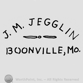 J.M. Jegglin: capital written on top. Line, dot, line, written under. Boonville, Mo. Written on the bottom.