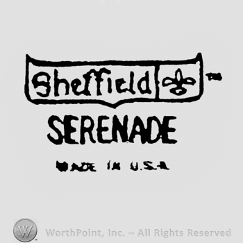 Sheffield written on the left, Fleur-de-lis appears on the right, on the ribbon. Serenade written under. Made in USA written on the bottom