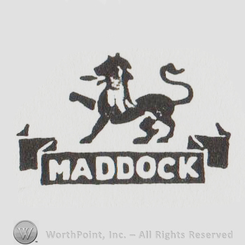 A Lion over a ribbon that says Maddock