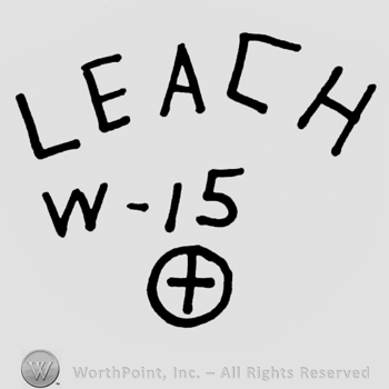 Leach curved written on top. W-15, + inside a circle on the bottom