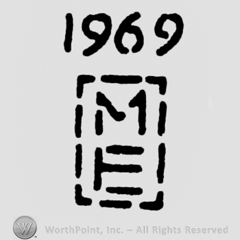 Initials M above E inside a rectangle 1969 above