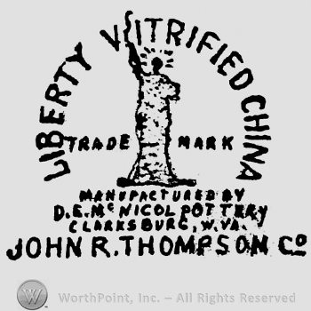 Curved writing Liberty Vitrified China up tred and mark left and right writing and John R Thompson Co under statue of liberty middle