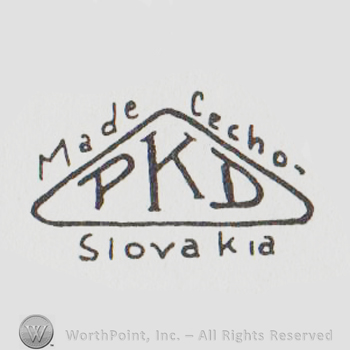 Uppercase PKD written inside a triangle, Made Cecho-Slovakia written on sides with lowercase letters