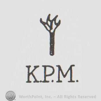 Uppercase KPM under a stylized claw