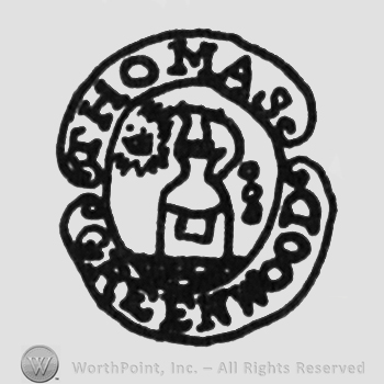 bottle of perfume, label above THOMAS, under GREENWOOD