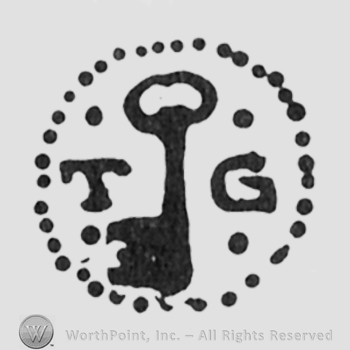 key initials TG left and right all inside a dotted circle