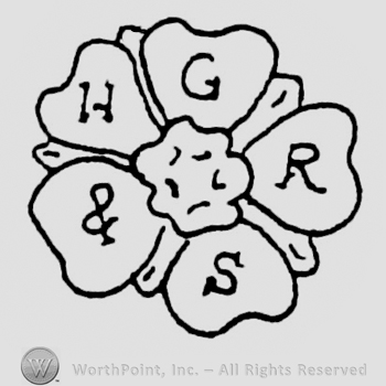 Two facing flower designs inside an oval