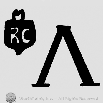 Uppercase RC inside a shield, uppercase V written upside-down