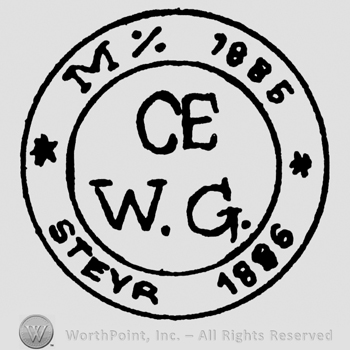 Uppercase M % CE W.G. Steyr 1886 written with uppercase letters inside a double circle