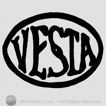 Vesta written with uppercase letters inside an oval