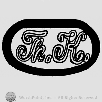 Handwritten uppercase Th. K. Written inside an oval
