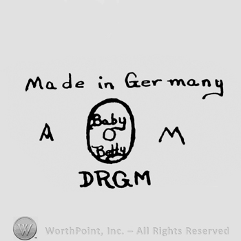 the text Made in Germany Above an oval mark with Baby Betty written inside; DRGM written bellow and initials A and M written one side and another.