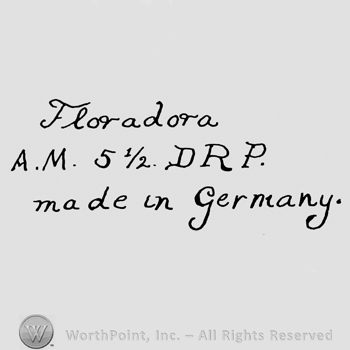 the text Florodora Made in Germany in handwriting; AM 5 1/2 DRP written in the centre.