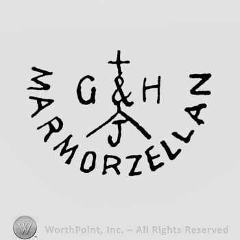 the text G&H J Marmorzellan and a cross above.