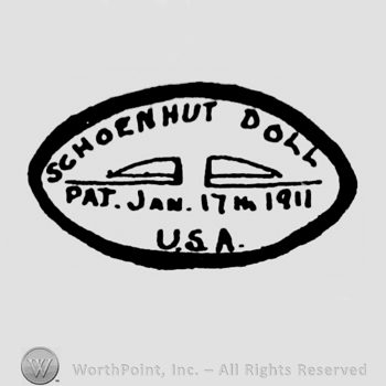 an oval sign with the text Schoenhut Doll Pat. Jam 1911 USA