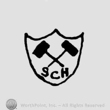 a shield with two crossed hammers on it and initials SCH