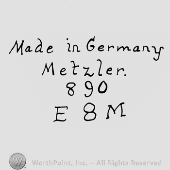 the text Made in Germany Metzler 890 E8M in handwriting