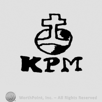 cross above the initials KPM