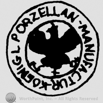 an eagle inside a round logo and PORZELLAN MANUFACTUR KOGNIGL written on the edge.