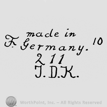 the text Made in Germany 211 JDK in handwriting