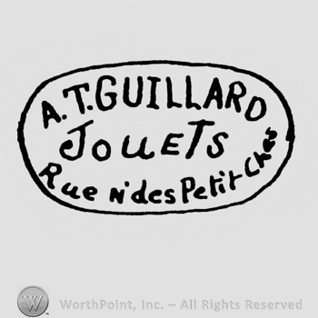 an oval logo with the name and adress of the company: A T GUILLARD JOUETS RUE DES PETIT CHES.