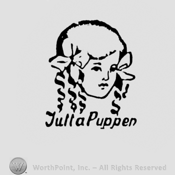 a doll face and JULLA PUPPEN written bellow.