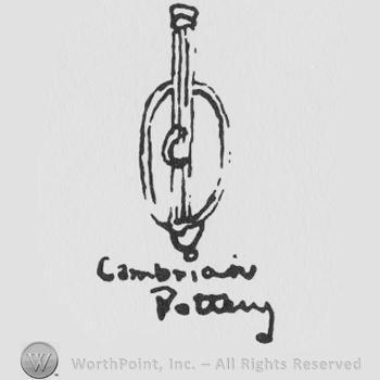 a paddle above the words CAMBRIAN POTTERY handwritten