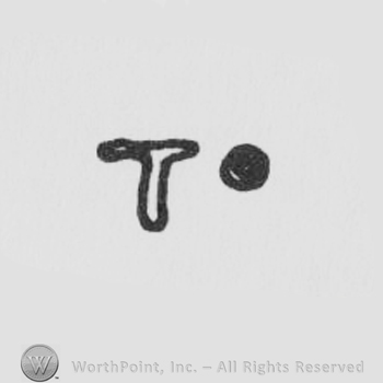 a letter T in uppercase and a dot