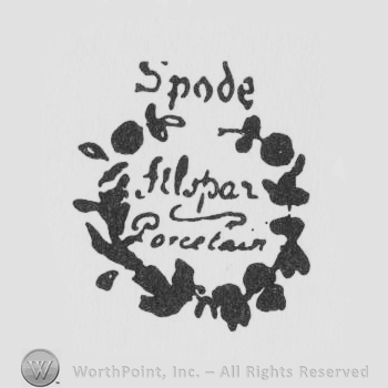 Spode written with lowercase letters over a complex round design with writings inside