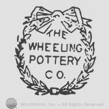 The Wheeling Pottery Co. Written with uppercase letters inside a circle of branches with a ribbon above