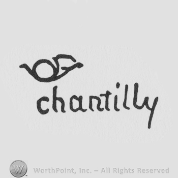 a trumpet and the word chantilly