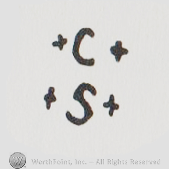a C between two + signs above an S between two + signs