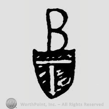 Initial B above a shield with letter T on.