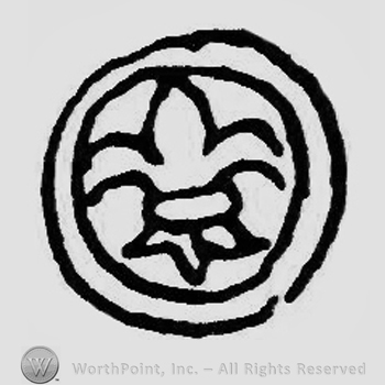 A double circle enclosing a fleur-de-lis.
