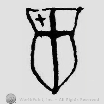 A shield with a cross on the left side.