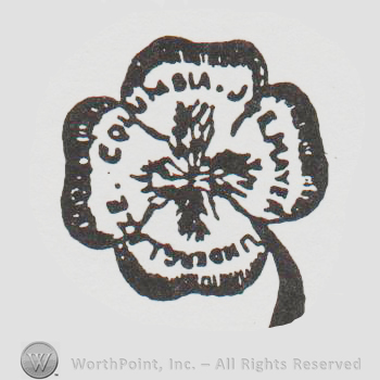 a four leaf clover with "columbia mayer underglaze" inscriptioned in uppercase letters
