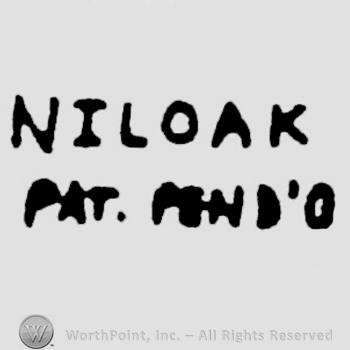 Niloak written above, Pat. Pend'o written under.