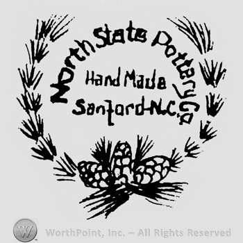 North State Pottery Co: curved and bold written on top. Hand Made Sanford. N.C. bold written under. Inside a semi-circle formed by two branches and 3 cones on the bottom.