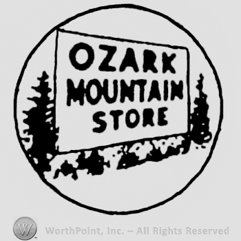 Ozark Mountain Store written in a square, near trees. Inside a circle.