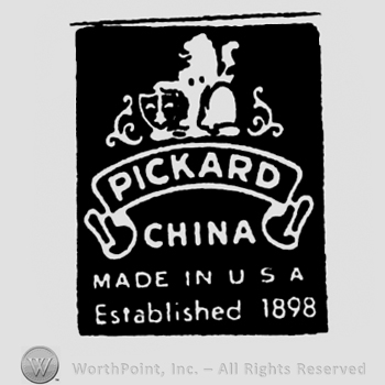 Pickard is written on a ribbon above China Made in USA Established 1898 and below a stylized lion with a shield on which is drawn a fleur-de-lis. Inside a black rectangle.