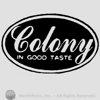Colony: bold written above, In Good Taste: written below. Inside a black background oval