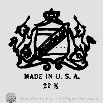 Two unicorns holding a crowned blazon. Made in U.S.A. 22 k written below