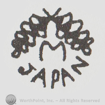 Branches over an uppercase M and the word Japan below