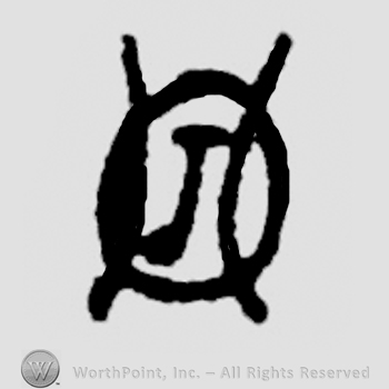 Capital letter J on a table viewed from above