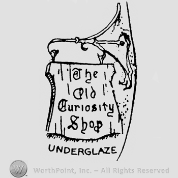 The Old Curiosity Shop written on a wood plate, Underglaze written below
