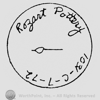 Rozart Pottery handwritten above, a brush in the middle. 1031-C-7-12 written below, in a circle