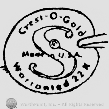 Crest-O-Gold written above, Warranted 22 k written below. In the center is a stylish initial S and Made in U.S.A. written over. All inside a painter's pallet form